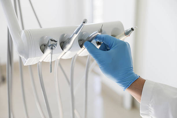 Professional Tooth Extraction technician working in Escambia County County, FL
